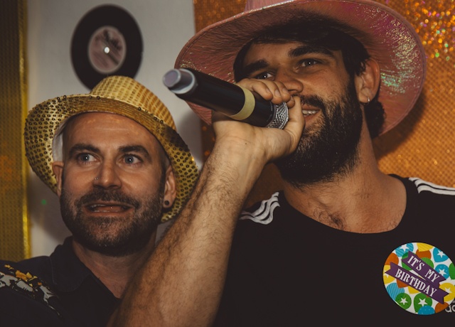 Friends performing a karaoke duet