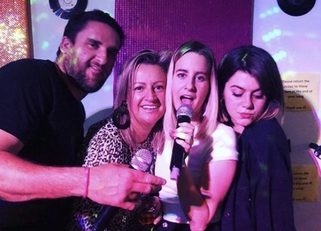 Friends enjoying a karaoke singalong at Benjys